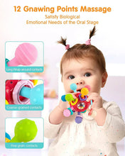 Red teething ball rattle toy with multiple textured nibs and ring-shaped chew grips