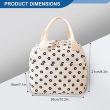 Beige lunch bag tote with black flower print, rounded shape and top handles