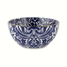 Blue and white patterned ceramic serving bowl with scalloped rim