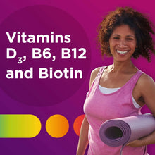 Woman holding rolled exercise mat in a pink tank top