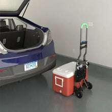 Folding hand truck with green handle, black wheels, and a compact base platform