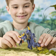Blue and gray robotic action figure with yellow parts held by child hands