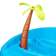 Close-up of palm tree spout on a blue kids water table toy