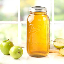 Amber wide-mouth mason jar with metal lid, Ball logo on front