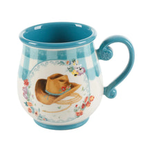 Stoneware mug with teal glaze, cowboy hat dog illustration, curved side handle