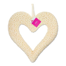 Beaded pearl heart wreath with pink hang tag on white beaded surface
