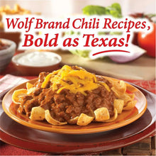 Wolf Brand chili served over chips on a plate with shredded cheese