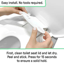 Hands pressing a stick-on toilet seat adapter onto a white toilet seat