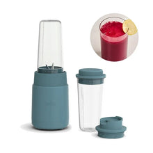 Portable rocket blender base with blending cup and travel lid, teal