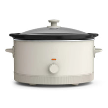 bella 6 qt manual slow cooker with dark lid and light ceramic body, temperature knob