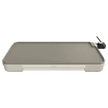 Electric griddle with warming tray, gray top with control knob at the side.