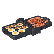 Black fold-and-store electric griddle with two cook plates, bacon and fried eggs