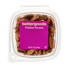 Praline pecans in clear plastic tub with purple Bettergoods label