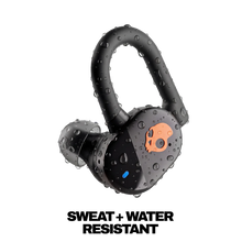 Black water-resistant true wireless earbuds with orange skull face icons