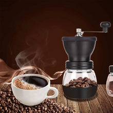 Manual coffee bean grinder with glass jar, coffee beans and ground coffee, dark body