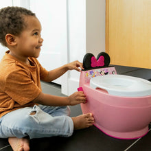 Pink toddler potty training seat with white lid and attached step bowl
