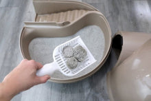 Enclosed plastic cat litter box with steps, opened lid and gray litter tray