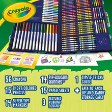 Crayola art supplies set contents in open blue case: crayons, colored pencils, markers
