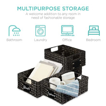 Woven dark storage basket holding books, cups, and kitchen items