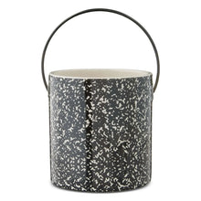Ceramic teacher pail with black speckled finish and curved handle, side view