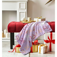 Lavender plush throw blanket with red bow and ribbon pattern