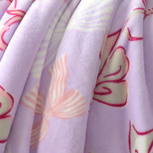 Lavender plush throw blanket with red and cream heart and bow icons