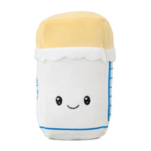 Butter plush with smiling face; white body and pale yellow cap