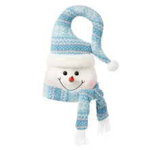 Blue plush snowman Christmas tree topper with knit hat, scarf, and smiling face