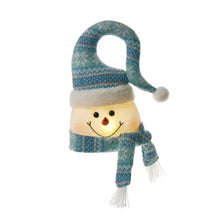 Blue plush snowman Christmas tree topper with knit hat, scarf, and dangling hands