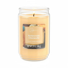 Scented jar candle with single wick, buttercream cheesecake label on amber wax
