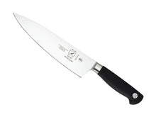 Chef's knife in profile with black handle and stainless-steel blade