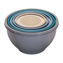 Stacked plastic mixing bowls with round beige lids and gray and blue outer bowls