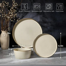 Ceramic dinnerware set with round plates and small bowls in khaki reactive glaze