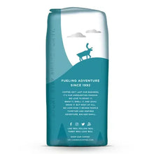 Caribou Coffee bag side panel with text and small forest graphic, sealed