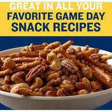 Honey roasted snack nuts in bowl, golden and brown coated pieces
