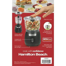 Black food chopper with clear bowl and stacked top, set for countertop blending
