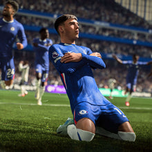EA SPORTS FC 26 PS5 game: blue-clad player sliding to control a ball