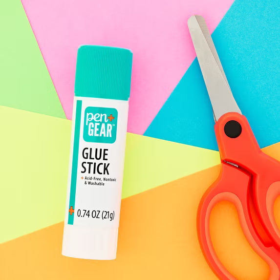 Pen+Gear washable glue stick with orange-handled scissors on colorful paper