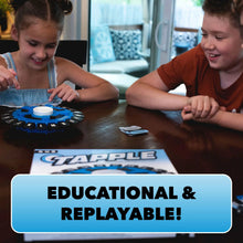 Children playing a blue word-tile spinner game on a table with cards