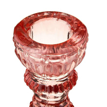 Pink glass taper candle holder top opening with ridged, textured sides
