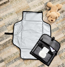 Gray portable changing mat with waterproof liner and attached wipes pocket