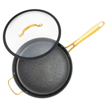 Open black non-stick sauté pan with gold handles