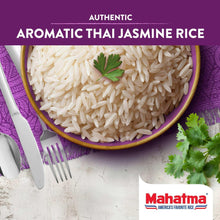 Top view of uncooked long grain jasmine rice in a bowl