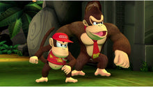Nintendo Switch platformer game screenshot: Donkey Kong with red-capped Diddy standing ready