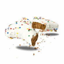 Bone-shaped dog treats with white icing and colorful sprinkles, broken pieces
