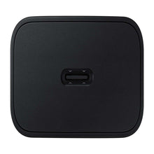 Wireless charging pad with centered port, dark gray.