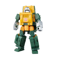 Yellow and green robot action figure with white faceplate, raised arms, and armored legs