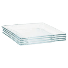 Stack of clear square glass dinner plates