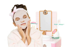 Kids spa play set with face mask and headband as child looks into vanity mirror