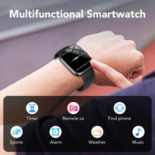 Smartwatch on a wrist with black screen and black silicone strap, hand touching the watch
